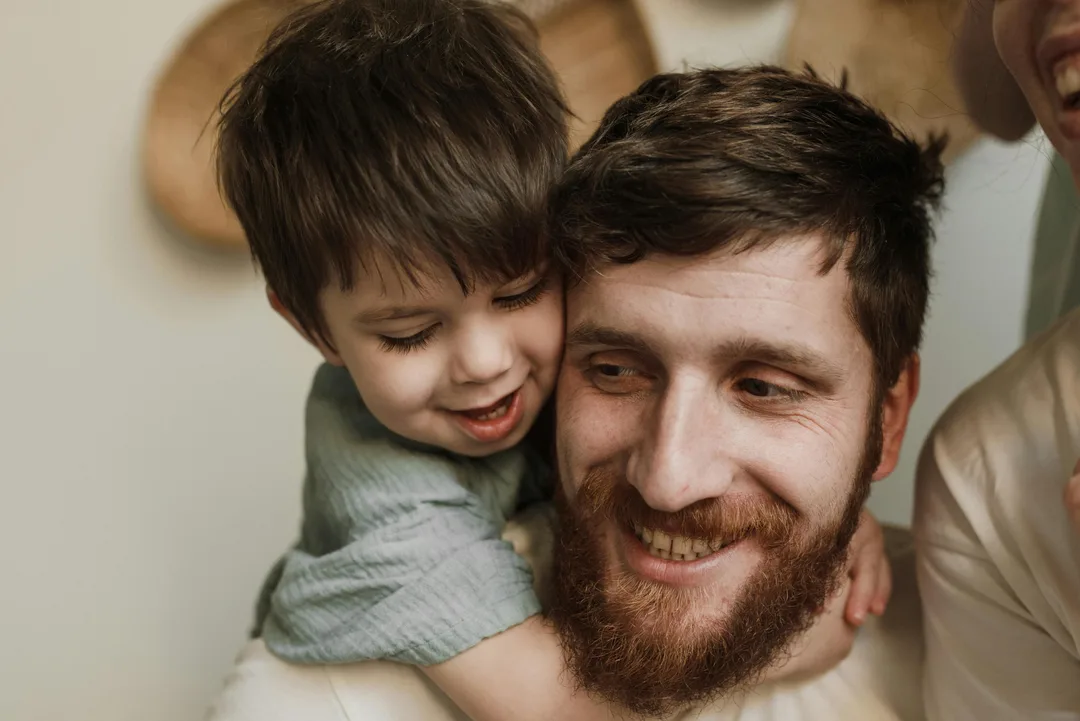 Smiling father son
